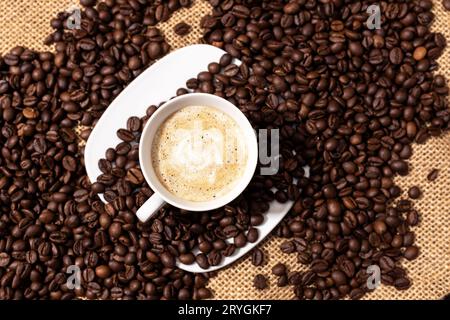 Top view of Coffee late cup and roasted beans Stock Photo