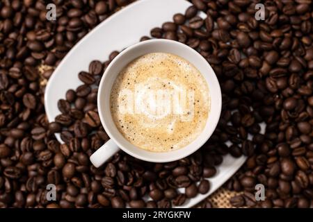 Top view of Coffee late cup and roasted beans Stock Photo