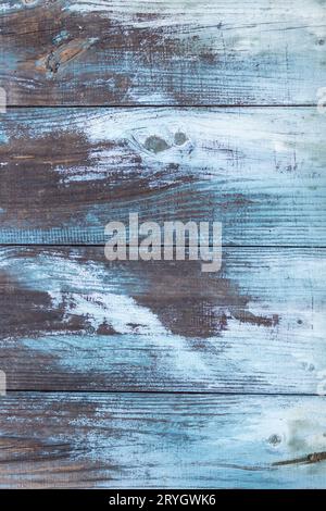 Aged wooden planks background with white and blue peeling paint Stock Photo