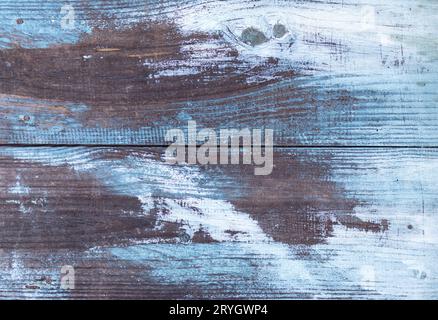 Aged wooden planks background with white and blue peeling paint Stock Photo