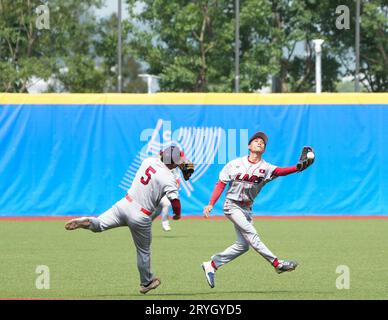 Shaoxing, China's Zhejiang Province. 1st Oct, 2023. Players of Laos compete during the Men's Second Group Round A of Baseball at the 19th Asian Games in Shaoxing, east China's Zhejiang Province, Oct. 1, 2023. Credit: Weng Xinyang/Xinhua/Alamy Live News Stock Photo