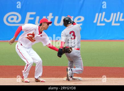 Shaoxing, China's Zhejiang Province. 1st Oct, 2023. Mong Lee (R) of Laos competes during the Men's Second Group Round A of Baseball at the 19th Asian Games in Shaoxing, east China's Zhejiang Province, Oct. 1, 2023. Credit: Weng Xinyang/Xinhua/Alamy Live News Stock Photo