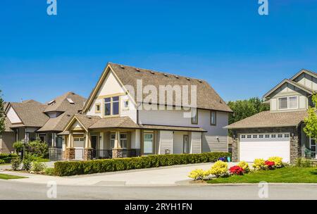 Big family house with concrete driveway to the garage Stock Photo