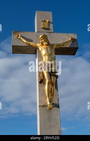 Golden crucified Jesus Christ on the cross. Close up. Detail. Nitra Calvary. Slovakia. Stock Photo