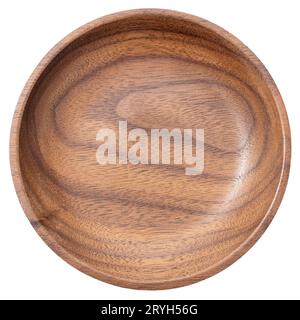 Empty round wooden plate or bowl isolated on white background. Walnut wood. Top view Stock Photo