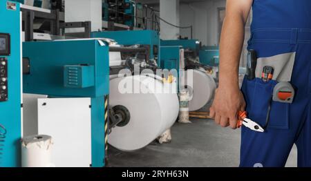 Man working in printing house Stock Photo