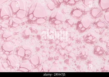 Skin care soap bubbles on pink background background texture. Full frame Stock Photo