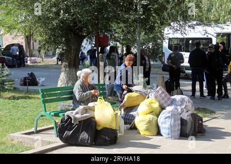 Vayk, Armenia. 30th Sep, 2023. Refugees from Nagorno-Karabakh with their belongings after a bus journey lasting several days. More than 100,000 Armenians have fled the conflict region of Nagorno-Karabakh in the South Caucasus after the military defeat against arch-enemy Azerbaijan. (to dpa-Korr: 'We have lost everything - refugee drama in Armenia') Credit: André Ballin/dpa/Alamy Live News Stock Photo