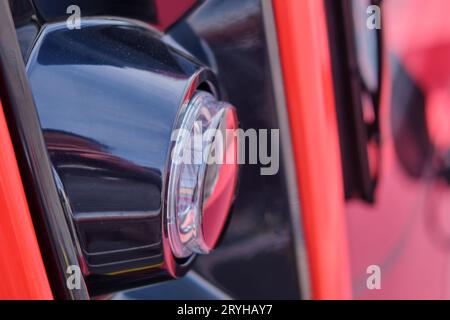 Close-up of the headlight of a train with red color Stock Photo