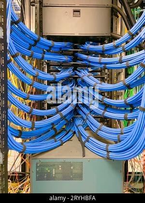 Copper cable infrastructure mounted in IT equipment rack Stock Photo