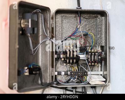 An old broken electrical panel Stock Photo