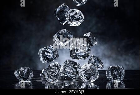 Falling ice cubes on black background Stock Photo