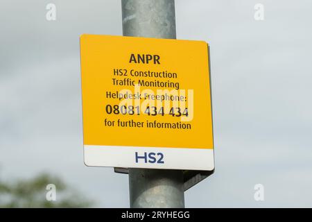 Harefield, London Borough of Hillingdon, UK. 30th September, 2023. An ANPR sign underneath HS2 cameras that are monitoring HS2 traffic in Harefield. Construction work is continuing on Phase 1 of the HS2 High Speed Rail in Harefield in the London Borough of Hillingdon. Huge viaduct piers are being built across a number of lakes in Harefield for the HS2 railway Colne Valley Viaduct. In the past few days there has been much speculation that Prime Minister Rishi Sunak is expected to announce the cancellation of the HS2 High Speed Rail Northern Leg from Birmingham to Manchester. Work has already be Stock Photo