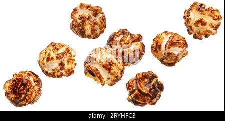 Falling caramel popcorn isolated on white background Stock Photo