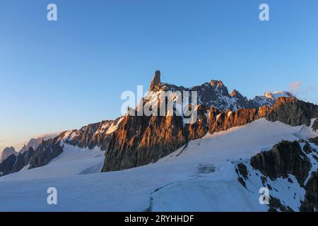 Alpenglow at sunset on the Dent du Géant (Dente del Gigante) mountain peak. The Mont Blanc group. Glacier. Monte Bianco. Alps. Europe. Stock Photo