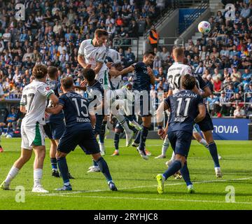 sports, football, Bundesliga, 2023/2024, VfL Bochum vs. Borussia Moenchengladbach 1-3, Vonovia Ruhr Stadium, scene of the match, aerial duel between Maximilian Woeber (MG) above and Anthony Losilla (Bochum) 4.v.r., DFL REGULATIONS PROHIBIT ANY USE OF PHOTOGRAPHS AS IMAGE SEQUENCES AND/OR QUASI-VIDEO Stock Photo