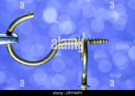 A colorful mix of nails and screws with eyelets and hoes Stock Photo
