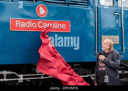 Mangapps Railway Museum, Burnham on Crouch, Essex, UK. 1st Oct, 2023. Rock musician and railway enthusiast Rick Wakeman has unveiled a nameplate on a restored vintage Class 31 diesel – ‘Radio Caroline’. The diesel locomotive numbered 31105 was built in 1959 and was used by British Rail on its mainlines and other uses before retirement in 2014.  Arriving at Mangapps in 2019 the loco has recently been restored into pristine BR blue livery. A new Radio Caroline radio station broadcasts locally and was involved with the naming. Wakeman took to the cab for a drive Stock Photo