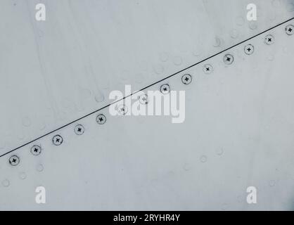 Silver metal surface with rivets Stock Photo - Alamy
