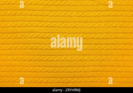 Background texture of yellow knitted wool fabric Stock Photo