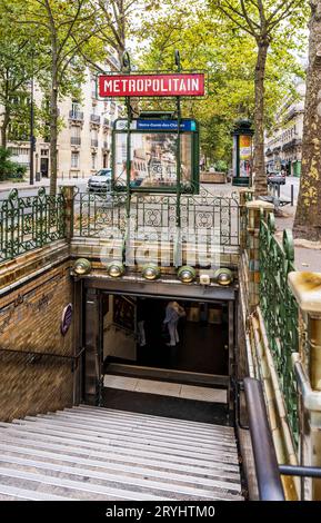 Vintage 'Metropolitain' (subway) red sign at the subway station Notre-dame-des-Champes in Paris city center, France Stock Photo