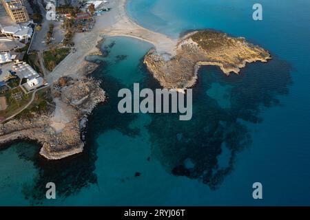 Aerial drone view of the coastline of empty beach in winter. Summer holidays. Stock Photo