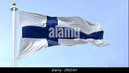 The national flag of Finland waving in the wind on a clear day. Stock Photo