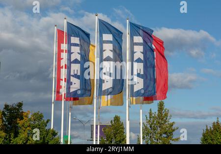 Bratislava, Slovakia - October, 3, 2022 : IKEA flags against the cloudy sky. IKEA has been the world's largest furniture retaile Stock Photo