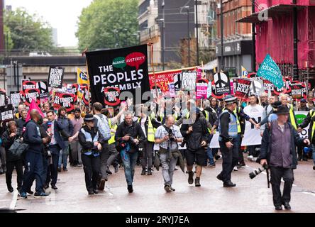 Manchester, UK. 01st Oct, 2023. People assembly protest in central Manchester. Thousands attended a rally which walked through central Manchester close to the Manchester central centre hosting the first day of Tory conference 2023. Manchester UK.Picture: garyroberts/worldwidefeatures.com Credit: GaryRobertsphotography/Alamy Live News Stock Photo