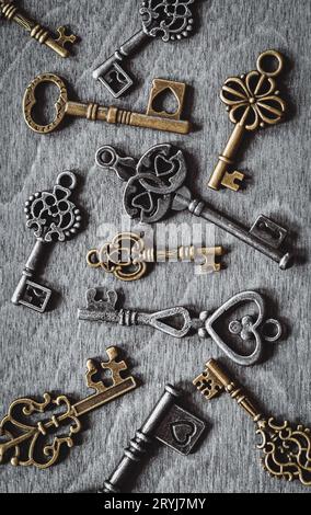 Retro keys collection on old wooden background Stock Photo