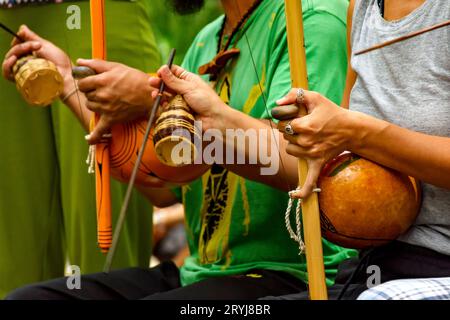 Playing an Afro Brazilian percussion musical instrument Stock Photo
