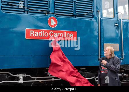 Rick Wakeman unveiling a locomotive named Radio Caroline at Mangapps Railway Museum near Burnham on Crouch, Essex, UK. Stock Photo