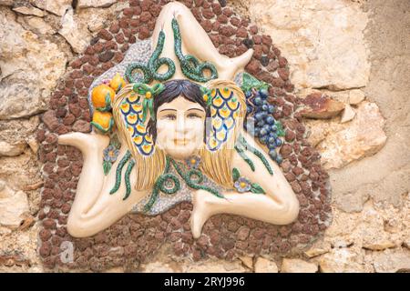 Symbol of Trinacria on a wall at Taormina Stock Photo