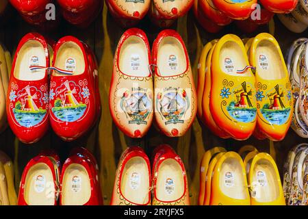 Many dutch traditional wooden shoes or clogs for sale in souvenir shop in Holland Stock Photo