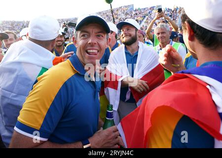 Team Europe's Rory McIlroy celebrates after Europe regained the Ryder Cup following victory over the USA on day three of the 44th Ryder Cup at the Marco Simone Golf and Country Club, Rome, Italy. Picture date: Sunday October 1, 2023. Stock Photo