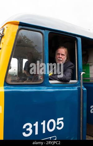 Rick Wakeman in cab of Class 31 diesel locomotive at Mangapps Railway Museum near Burnham on Crouch, Essex, UK. Ready to drive it Stock Photo