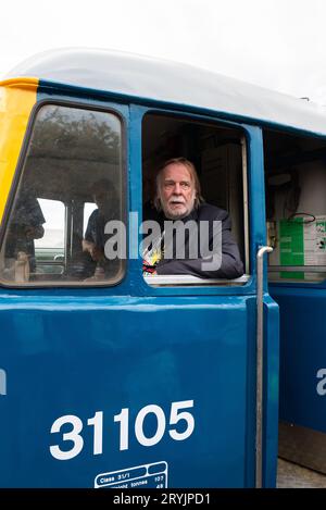 Rick Wakeman in cab of Class 31 diesel locomotive at Mangapps Railway Museum near Burnham on Crouch, Essex, UK. Ready to drive it Stock Photo