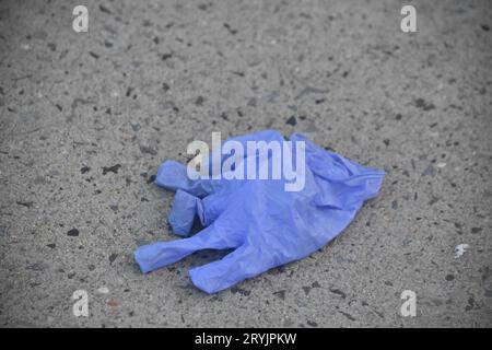 Jersey, United States. 01st Oct, 2023. Gloves left at the crime scene. Five people were reportedly shot outside 224 Lounge in Jersey City. At approximately 2:42 AM, reports came in of multiple people shot on Culver Avenue. Daybreak, debris left from the shooting was present at the scene outside the lounge including crime scene tape, blood on the sidewalk and shoes. Roses were also left at the crime scene. Information from authorities was not immediately available. Credit: SOPA Images Limited/Alamy Live News Stock Photo