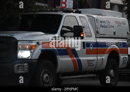 Jersey, United States. 01st Oct, 2023. Jersey City Medical Center vehicle seen at the crime scene. Five people were reportedly shot outside 224 Lounge in Jersey City. At approximately 2:42 AM, reports came in of multiple people shot on Culver Avenue. Daybreak, debris left from the shooting was present at the scene outside the lounge including crime scene tape, blood on the sidewalk and shoes. Roses were also left at the crime scene. Information from authorities was not immediately available. Credit: SOPA Images Limited/Alamy Live News Stock Photo