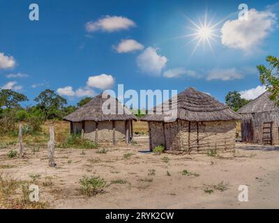 Okavango Delta in Botswana, rondavel traditional african buildings in the village , empty yard of a villager Stock Photo