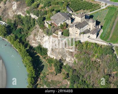 AERIAL VIEW. Château Sarriod de la Tour on a clifftop. Saint-Pierre, Aosta Valley, Italy. Stock Photo