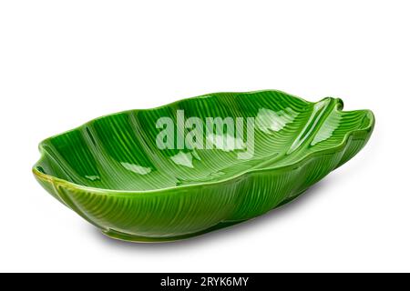 Empty beautiful green leaf shape ceramic bowl isolated on white background. Stock Photo
