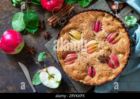 Apple baking gluten free seasonal. Autumn pie with apples, hazelnut and cinnamon on a wooden table. Top view flat lay background Stock Photo