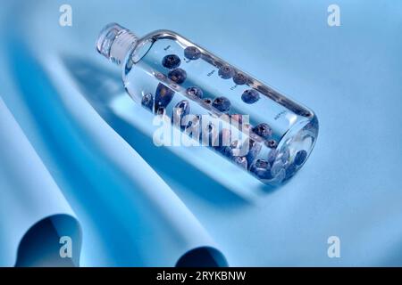 A glass bottle of pure water with blueberries. Stock Photo