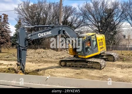 Calgary, Alberta, Canada. Feb 24, 2023. A John Deere 245G Hydraulic Excavator in a new development in the North West of Calgary. Stock Photo
