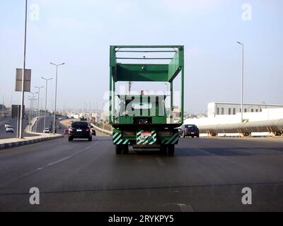 Cairo, Egypt, September 19 2023: Electric vehicle mounted lifting hoist on flatbed truck for emergency transportations of cars that needs maintenance, Stock Photo