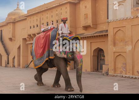 Golden Triangle, India - November 9th 2019 - Decorated elephant being ridden by a man in a turban in an Indian fort Stock Photo