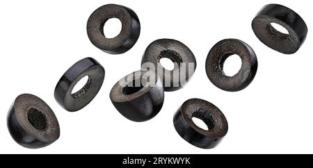 Falling black olive slices isolated on white background Stock Photo
