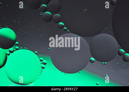 Abstract dark gray green background with oil circles water surface Stock Photo