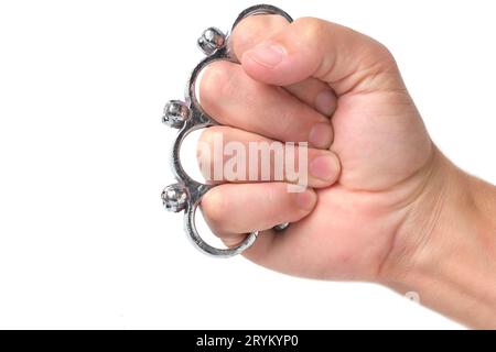 Metal brass knuckles cold steel worn on fist, white background Stock Photo